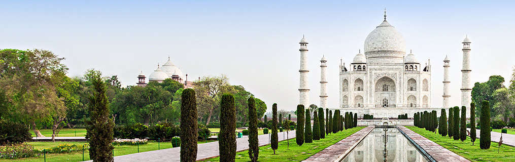 The walkway and pools leading up to the Taj Mahal which appears in the distance.